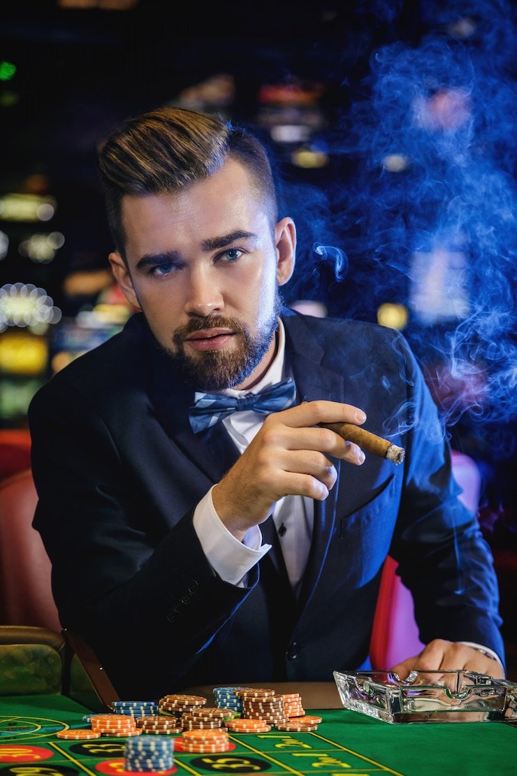 Live Sic Bo dealer rolling three dice from a transparent shaker with camera angles visible